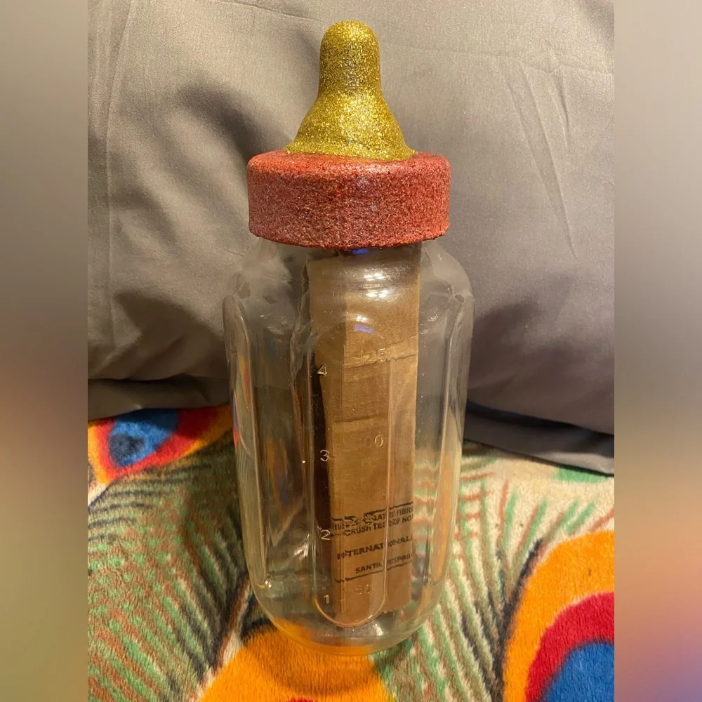 Red and Gold Oversized Plastic Baby Bottle Decor